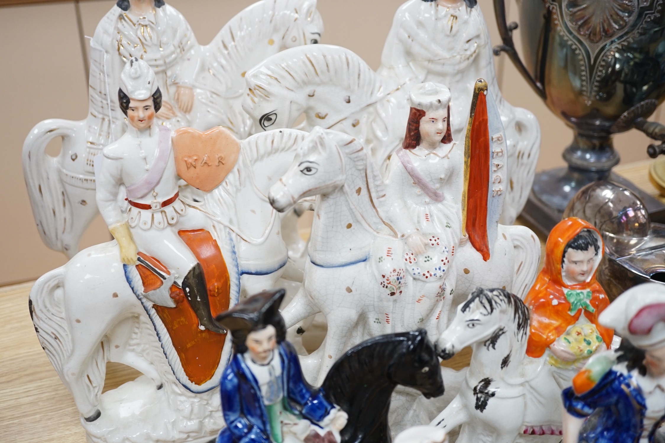 Two pairs of Staffordshire flat backs of figures on horseback, two others, a mother and child and flower seller